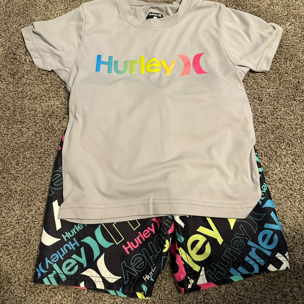 Hurley Gray Rash Guard and Swim Trunk. 2 Hurley swim trunks only. Size 5.